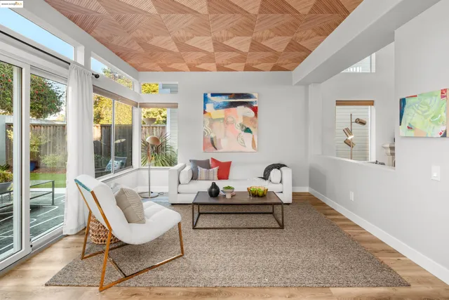 a bedroom with furniture and a flat screen tv