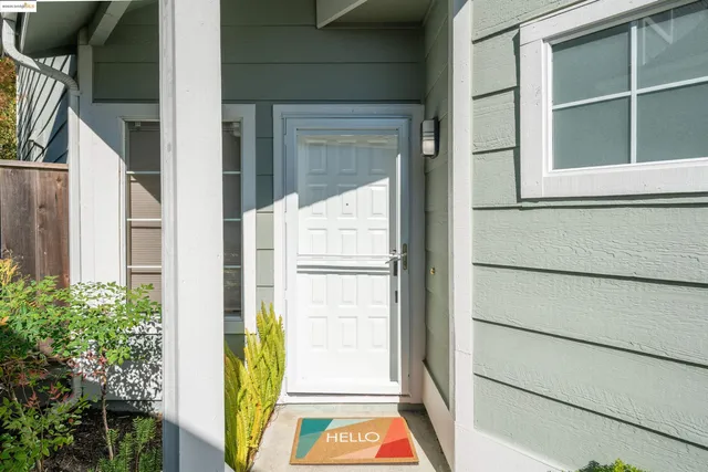 a kitchen with stainless steel appliances granite countertop a stove a sink a refrigerator and a cabinets