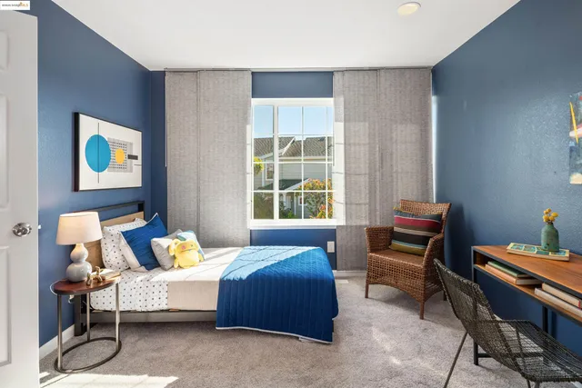a bathroom with double vanity sinks and a mirror