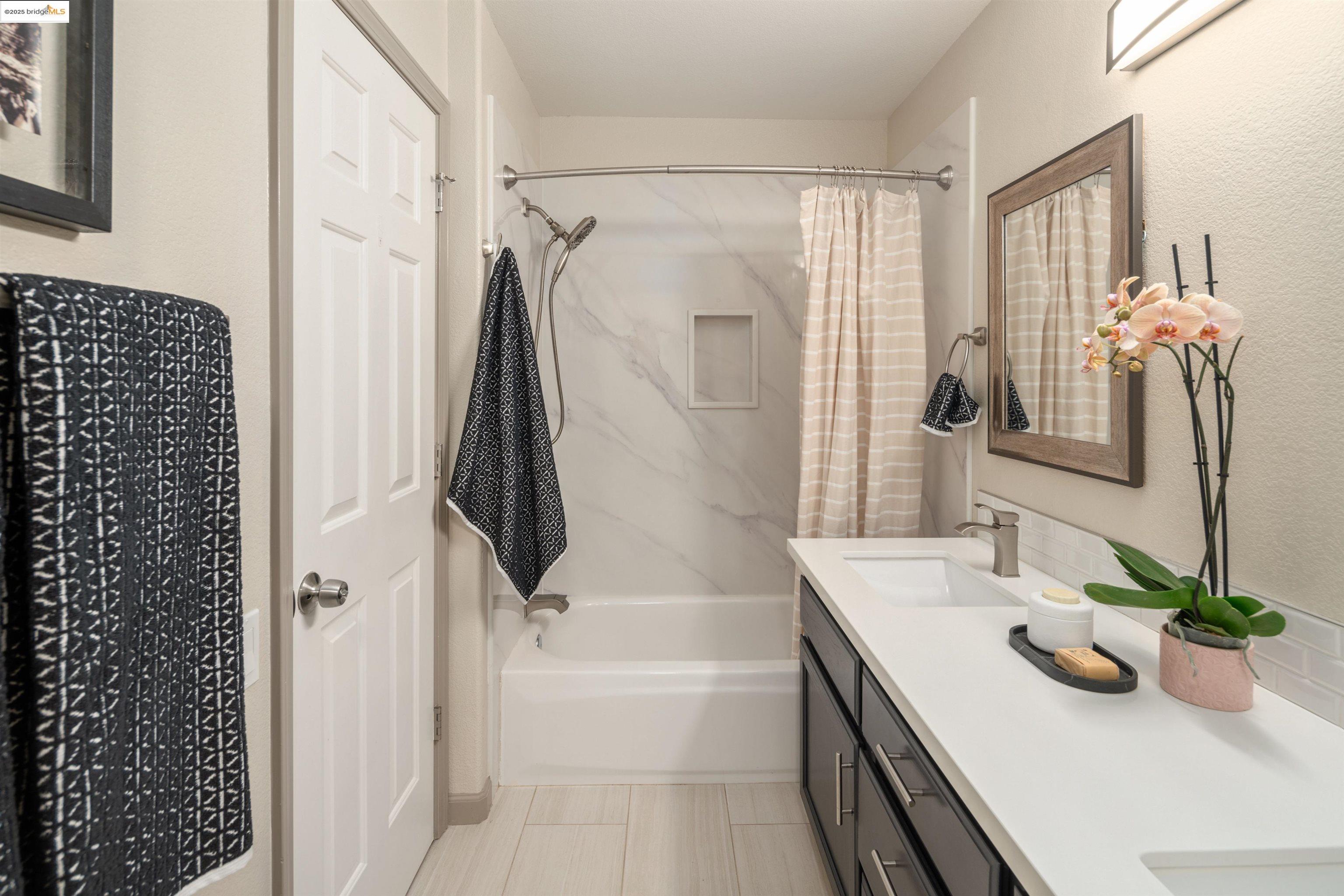 35 Southwind Circle Richmond, CA 94804 - Photo 47 of 59 a bathroom with a tub sink and mirror