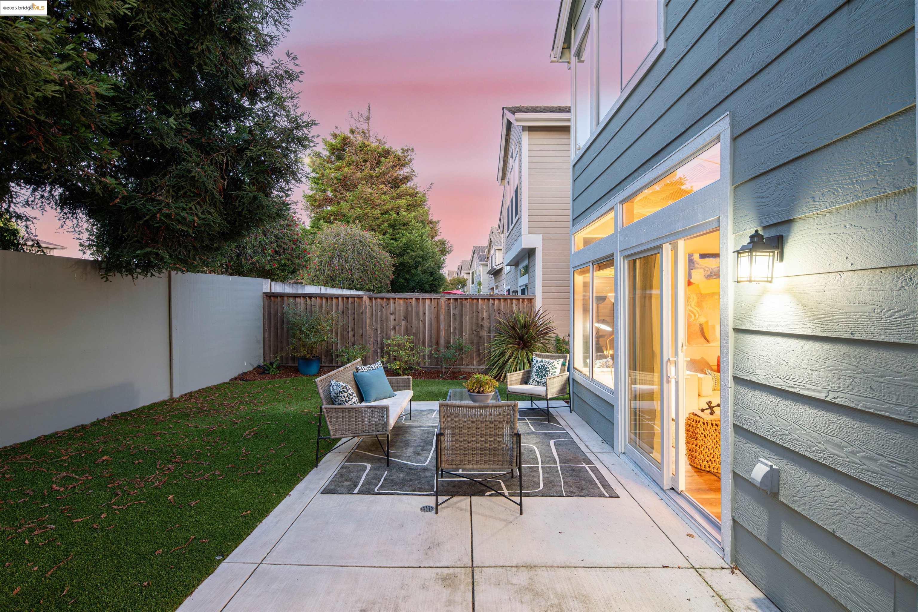35 Southwind Circle Richmond, CA 94804 - Photo 50 of 59 a view of backyard with a table and chairs and potted plants