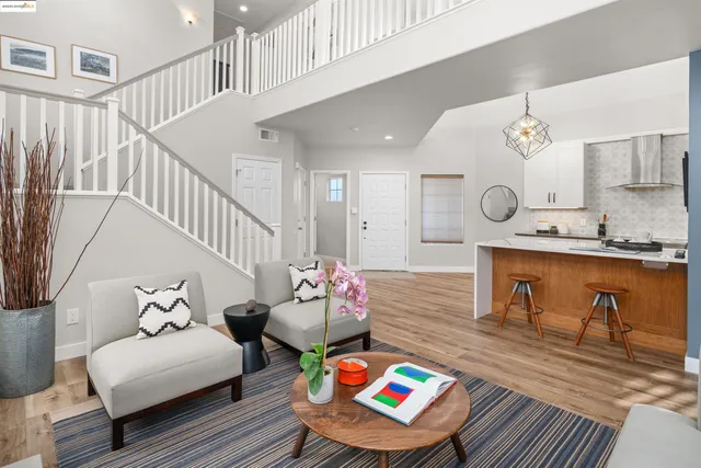 a kitchen with stainless steel appliances granite countertop a sink a stove and a microwave