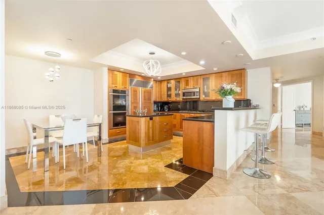 a view of an empty room with window and cabinet