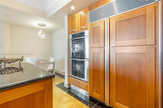 a view of a dining room with furniture large window and wooden floor