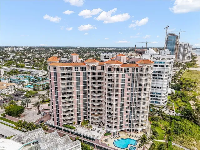 a living room with furniture and a large window with outer view