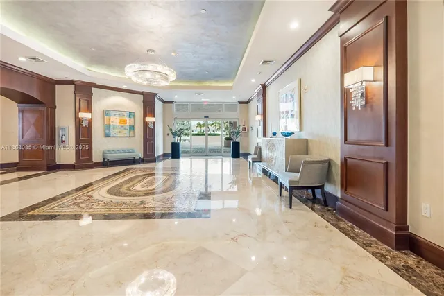 a view of a livingroom with furniture and floor to ceiling window