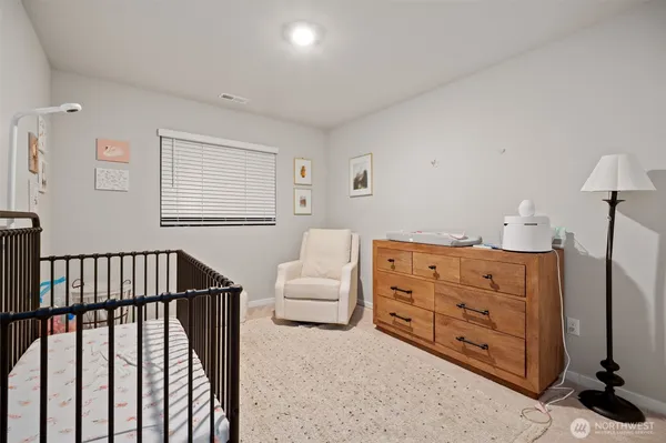a bedroom with furniture and a window