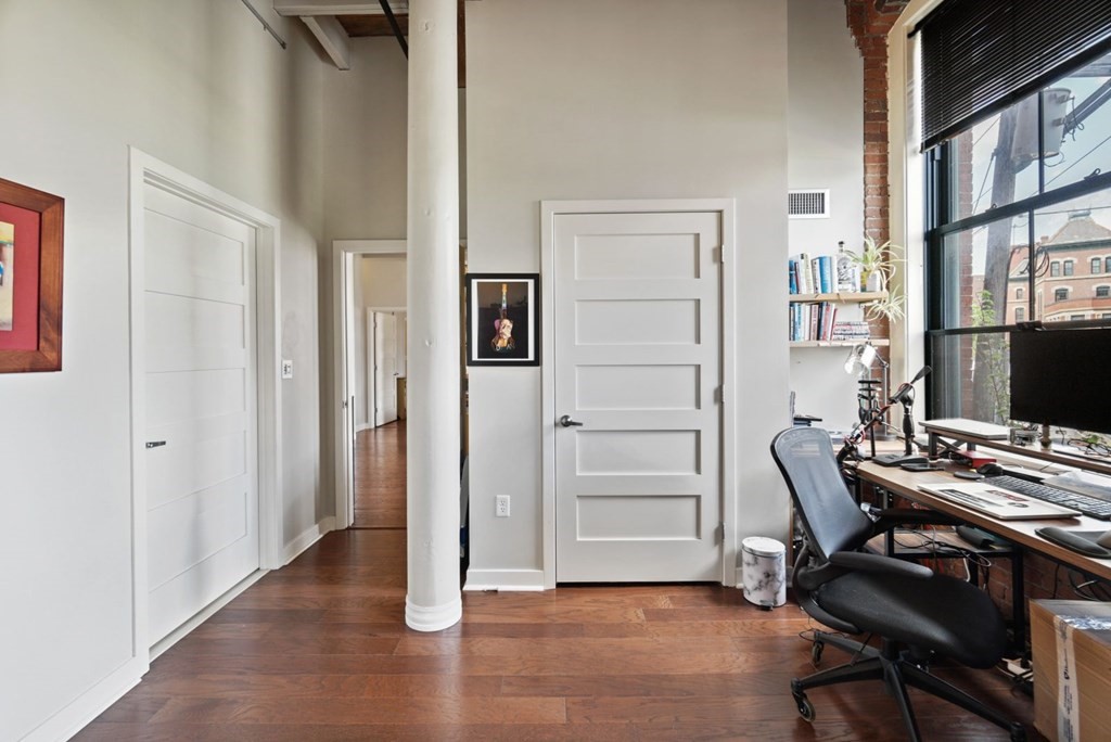 1245 Adams Street, Unit B210 Boston, MA 02124 - Photo 13 of 23 a view of a workspace with furniture and a window