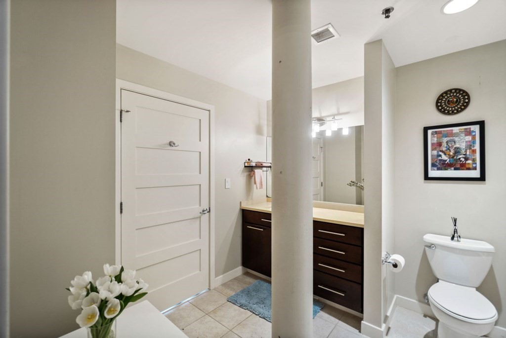 1245 Adams Street, Unit B210 Boston, MA 02124 - Photo 14 of 23 a bathroom with a toilet and a shower