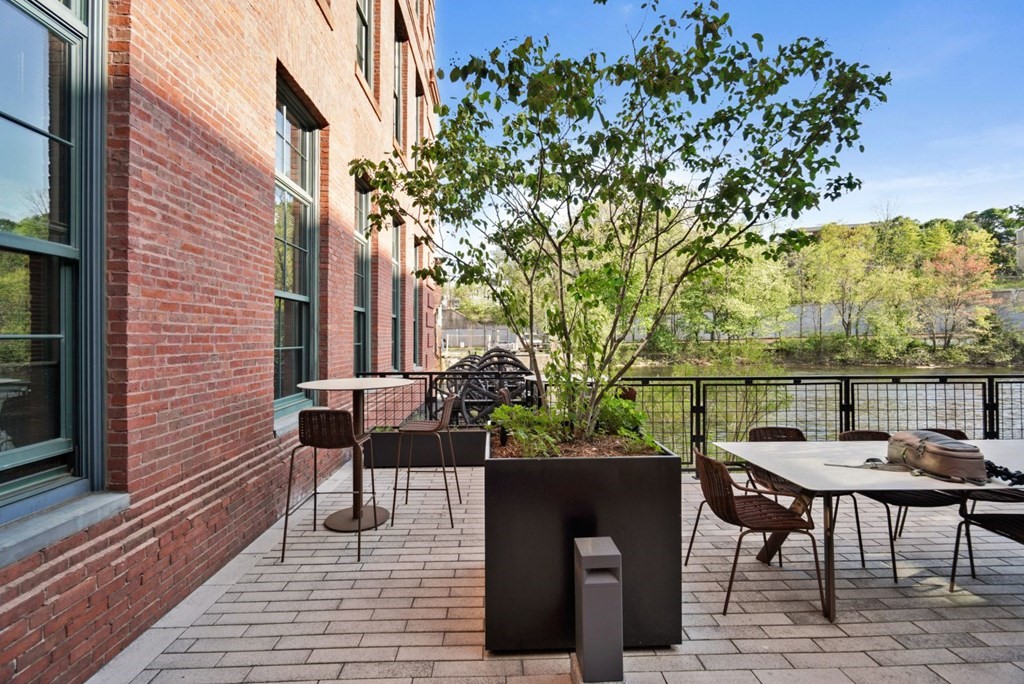 1245 Adams Street, Unit B210 Boston, MA 02124 - Photo 19 of 23 a view of a tables and chairs in patio
