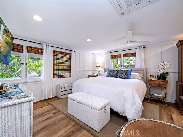 1570 Burgundy Road Encinitas, CA 92024 - Photo 20 of 47 a spacious bedroom with a large bed and windows