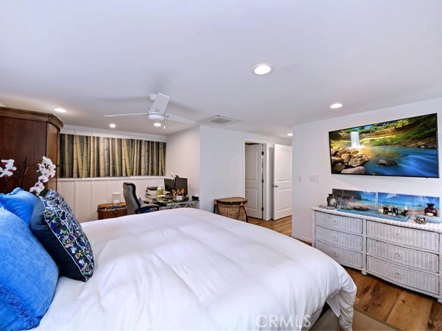 1570 Burgundy Road Encinitas, CA 92024 - Photo 21 of 47 a bed room with a bed and a television