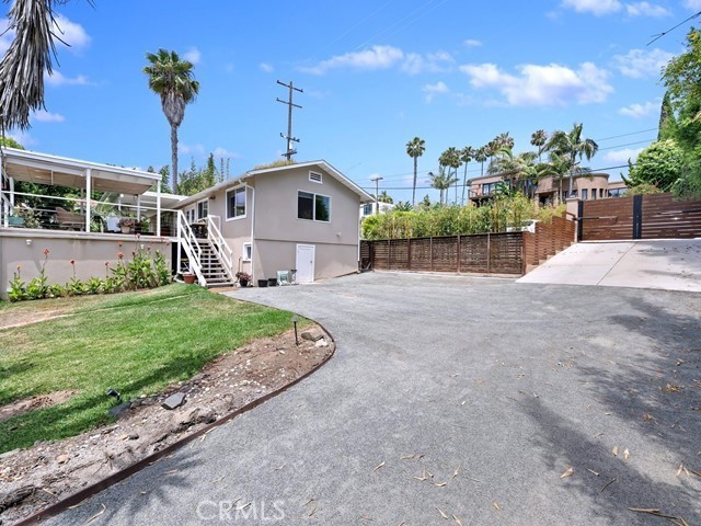 1570 Burgundy Road Encinitas, CA 92024 - Photo 30 of 47 a view of a house with a yard and potted plants