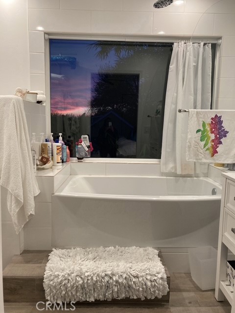 1570 Burgundy Road Encinitas, CA 92024 - Photo 38 of 47 a bathroom with a bathtub and shower