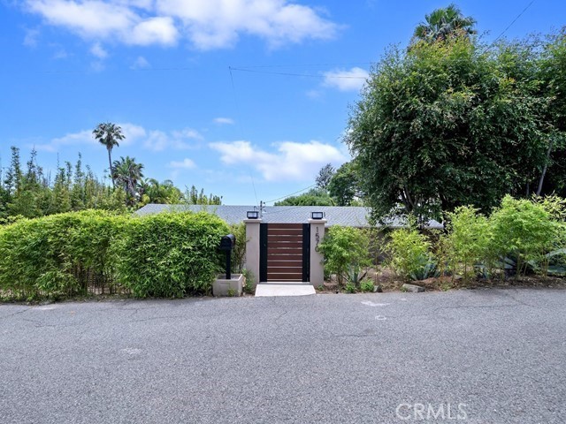 1570 Burgundy Road Encinitas, CA 92024 - Photo 7 of 47 a front view of a house with a yard