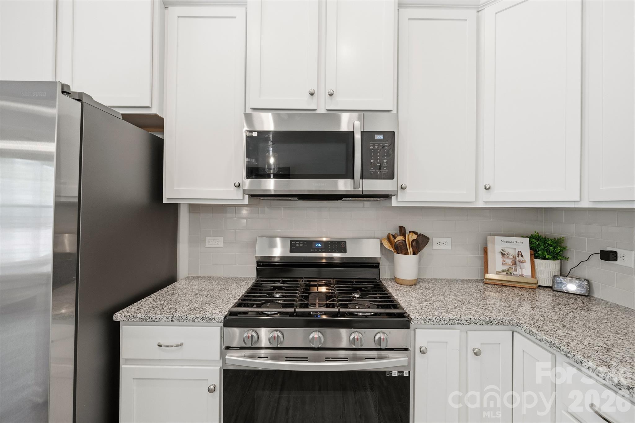 8220 Mccormick Street Terrell, NC 28682 - Photo 14 of 33 a stove top oven sitting inside of a kitchen