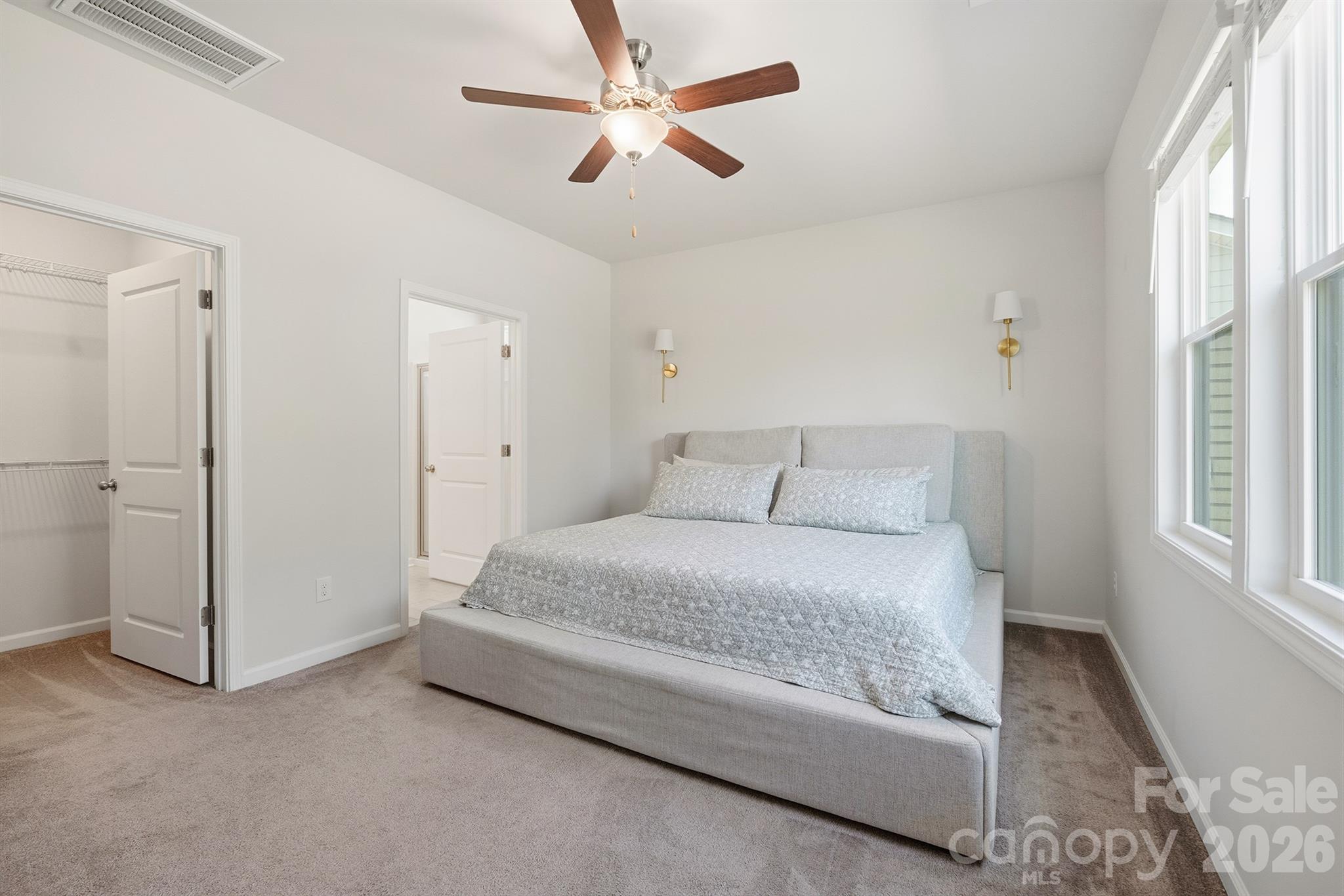 8220 Mccormick Street Terrell, NC 28682 - Photo 15 of 33 a spacious bedroom with a bed and a window