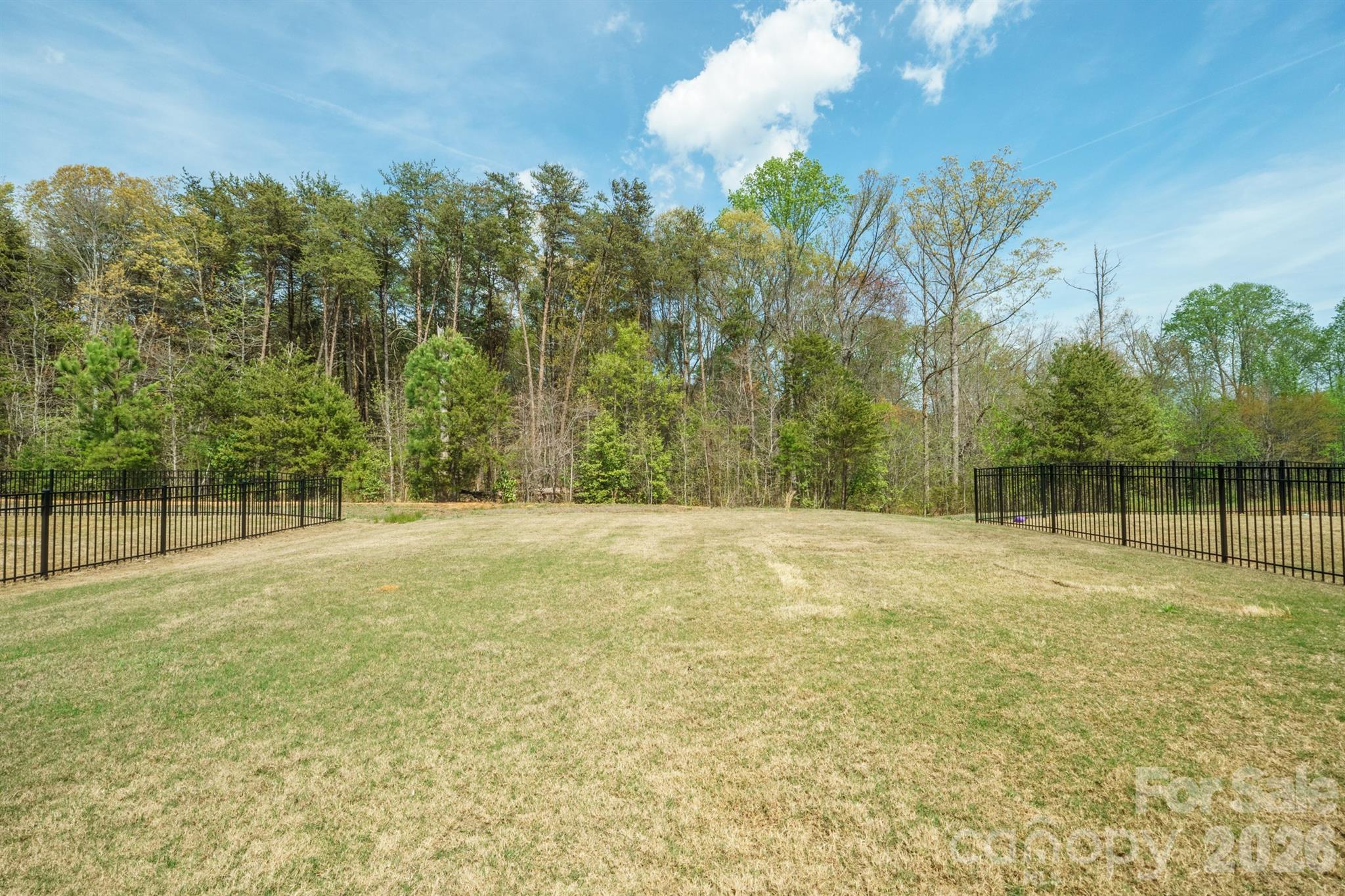8220 Mccormick Street Terrell, NC 28682 - Photo 2 of 33 a swimming pool with trees in the background