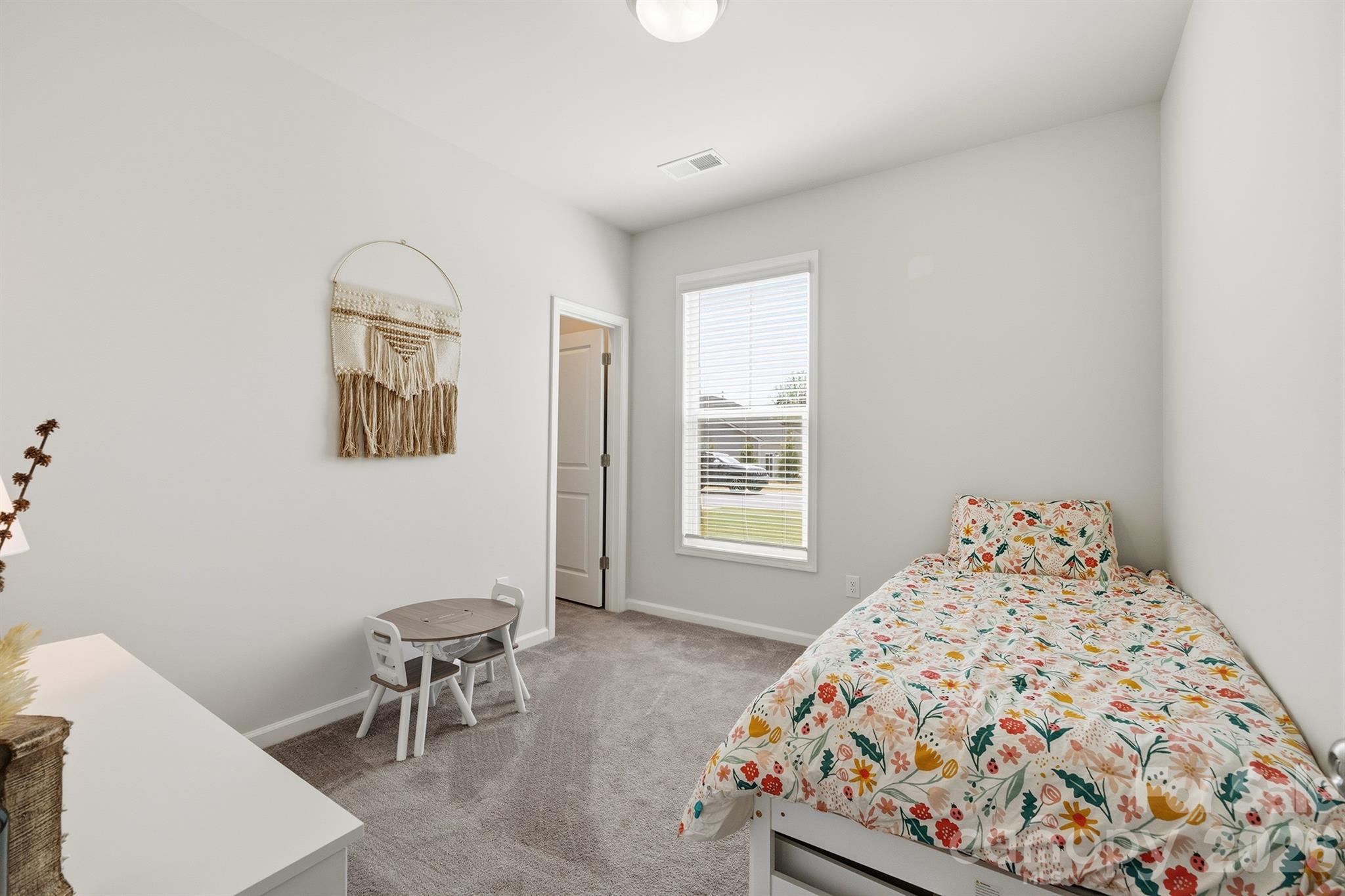 8220 Mccormick Street Terrell, NC 28682 - Photo 21 of 33 a bedroom with a bed and a window