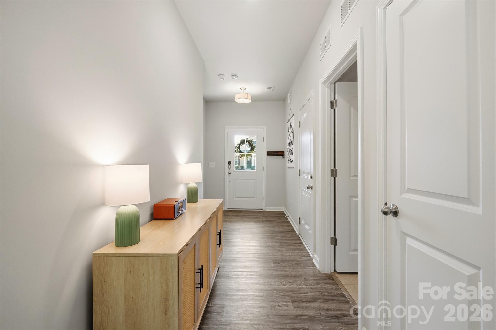 8220 Mccormick Street Terrell, NC 28682 - Photo 22 of 33 a hallway with a sink a washer and dryer