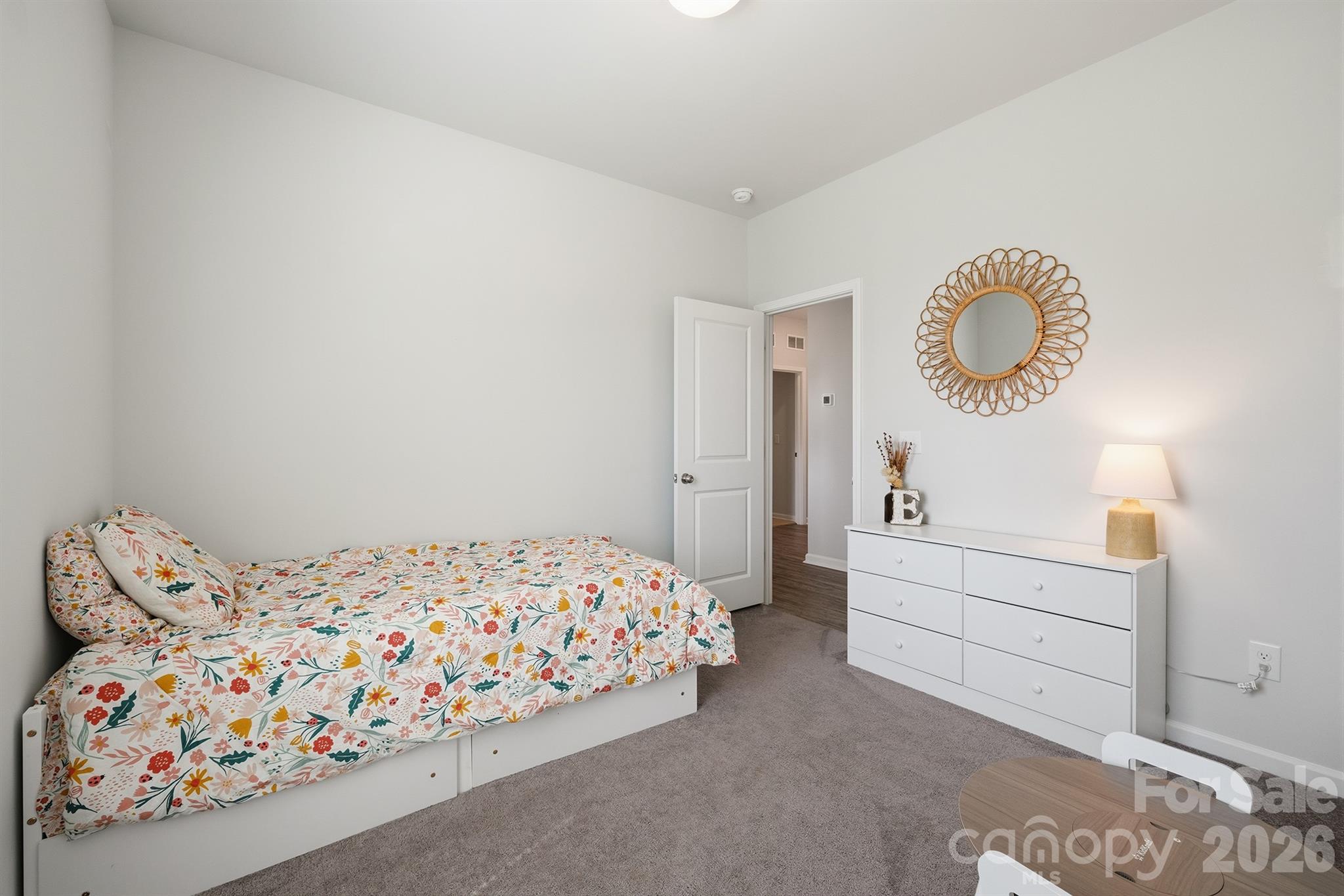 8220 Mccormick Street Terrell, NC 28682 - Photo 23 of 33 a bedroom with a bed and a chandelier