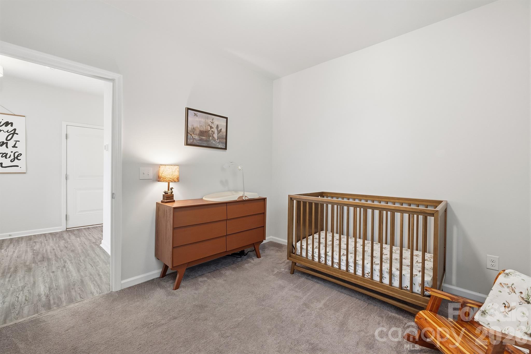8220 Mccormick Street Terrell, NC 28682 - Photo 25 of 33 a room with stairs and a couch