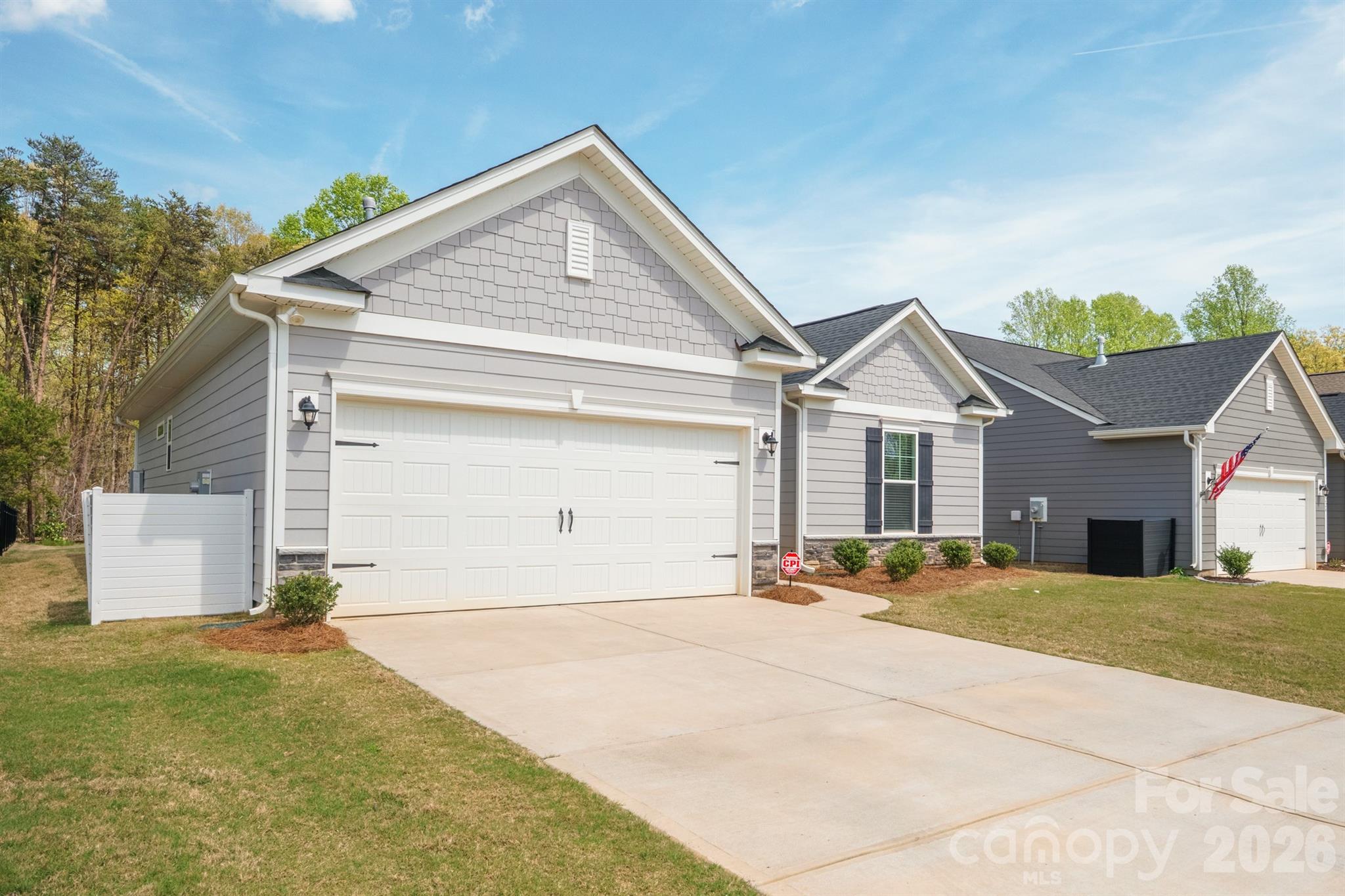 8220 Mccormick Street Terrell, NC 28682 - Photo 33 of 33 a front view of a house with a yard and garage