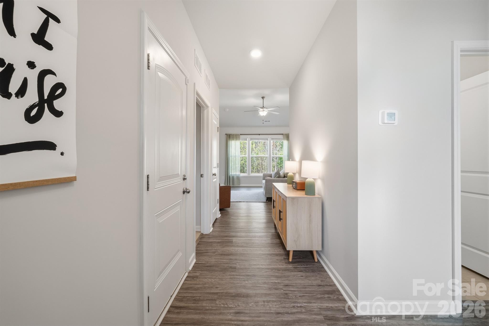 8220 Mccormick Street Terrell, NC 28682 - Photo 4 of 33 a hallway with white cabinets and wooden floor