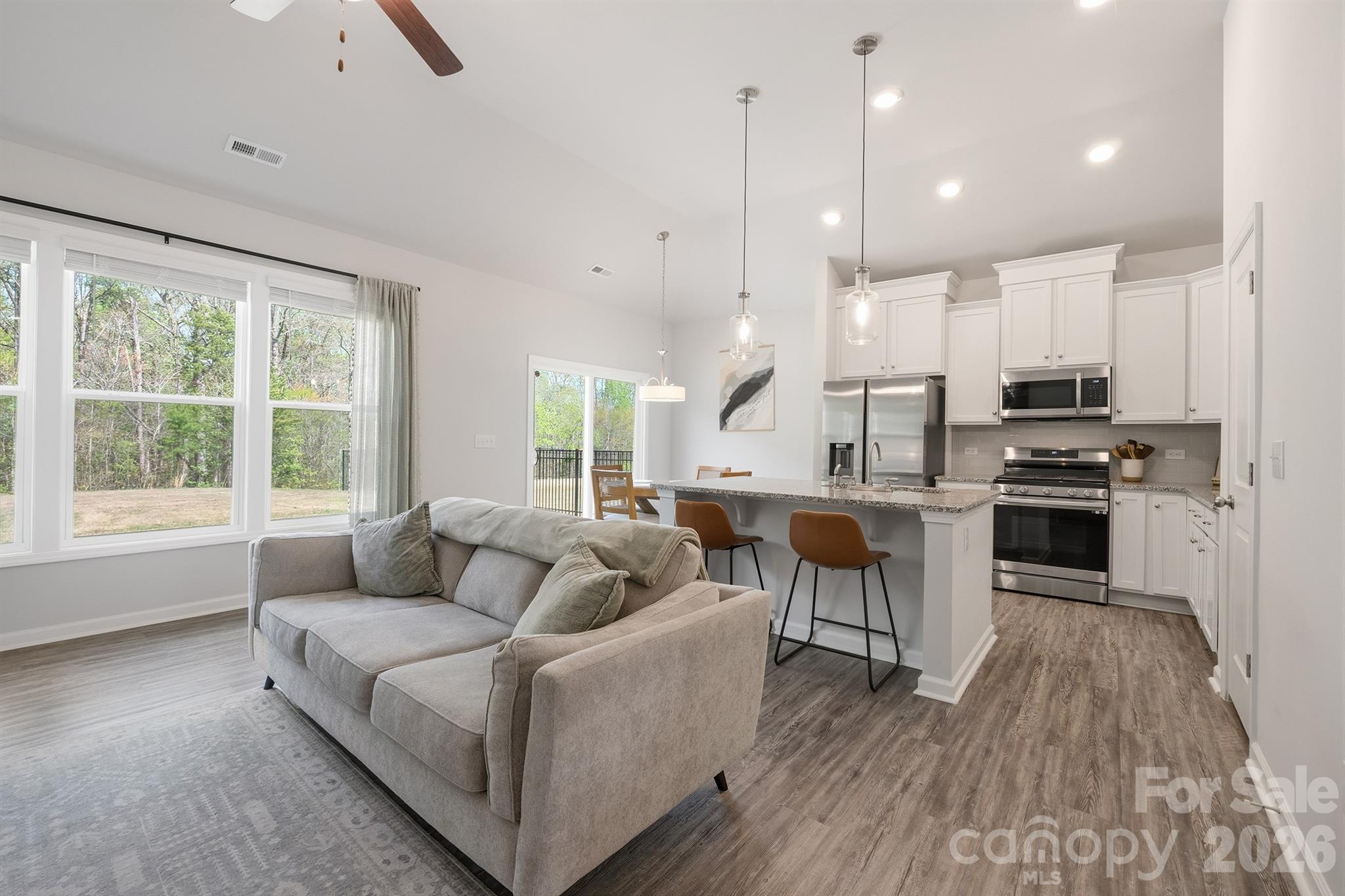 8220 Mccormick Street Terrell, NC 28682 - Photo 6 of 33 a living room with furniture and a large window