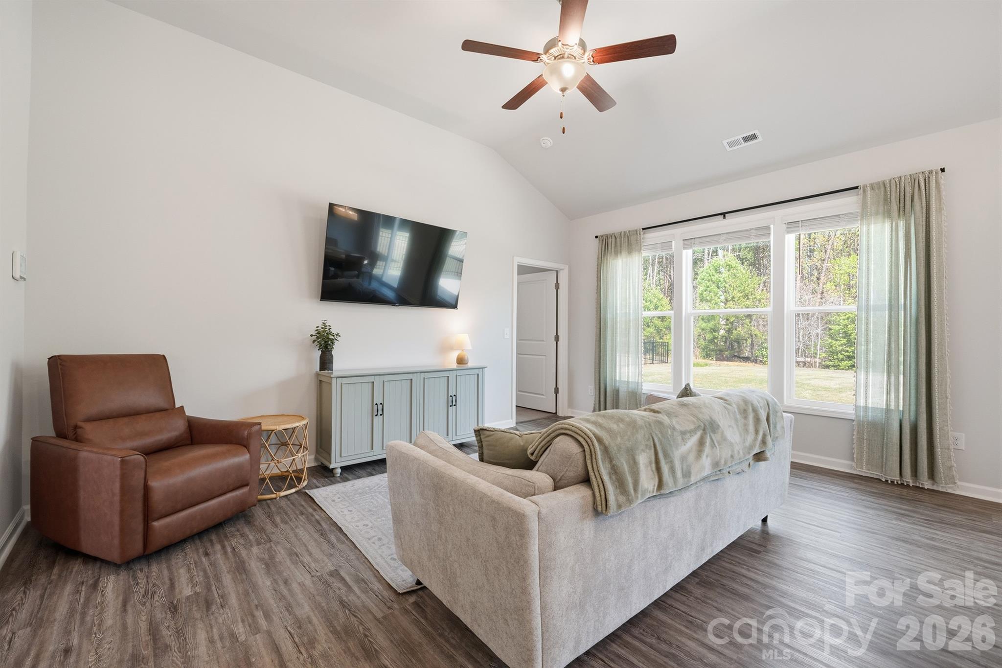 8220 Mccormick Street Terrell, NC 28682 - Photo 8 of 33 a living room with furniture and a flat screen tv