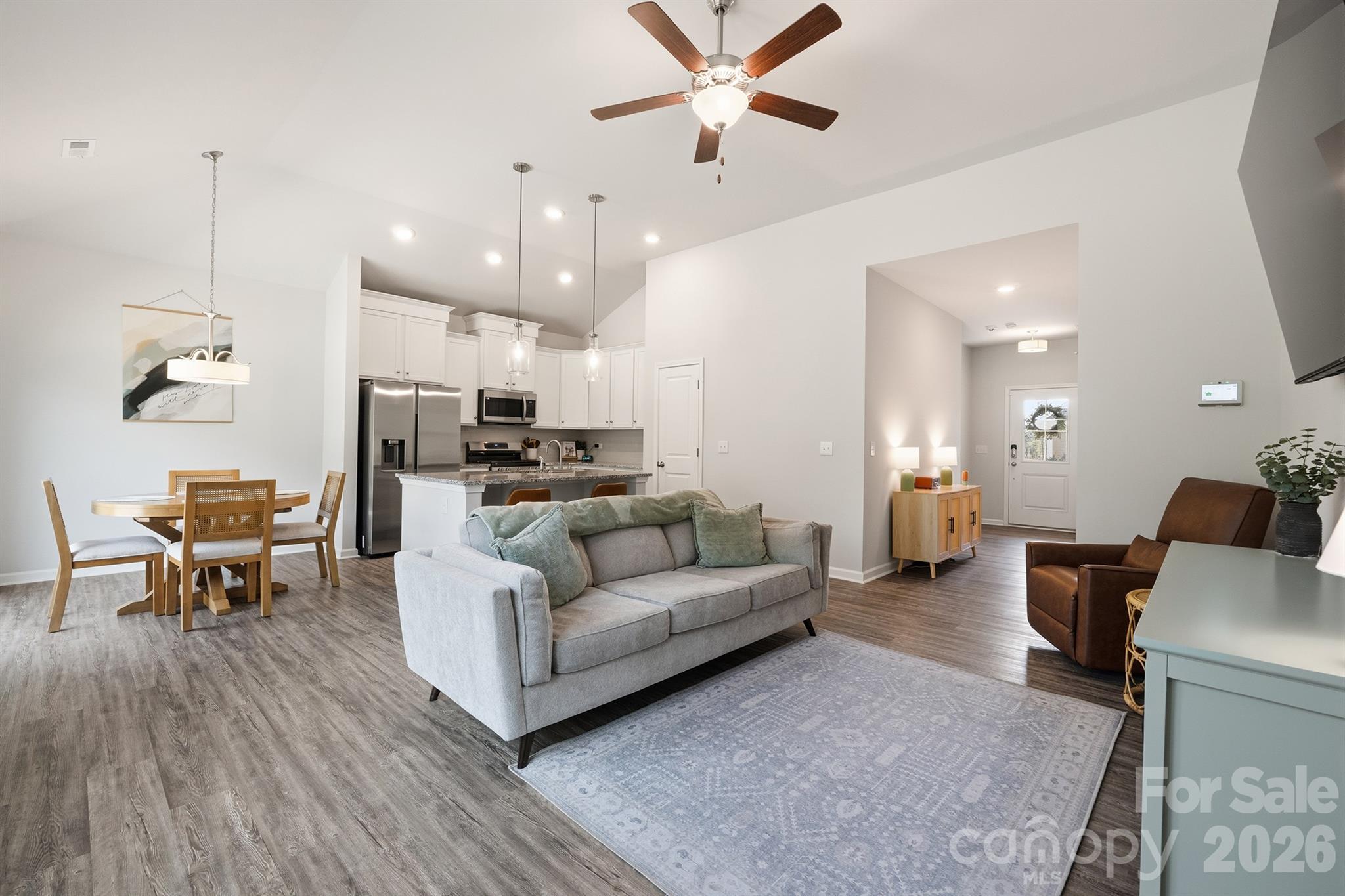 8220 Mccormick Street Terrell, NC 28682 - Photo 9 of 33 a living room with furniture kitchen view and a wooden floor