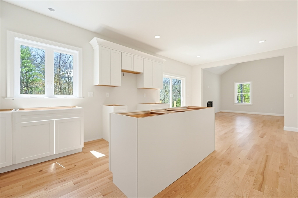 112 West Meadow Road Townsend, MA 01474 - Photo 2 of 38 a view of kitchen with wooden floor and electronic appliances
