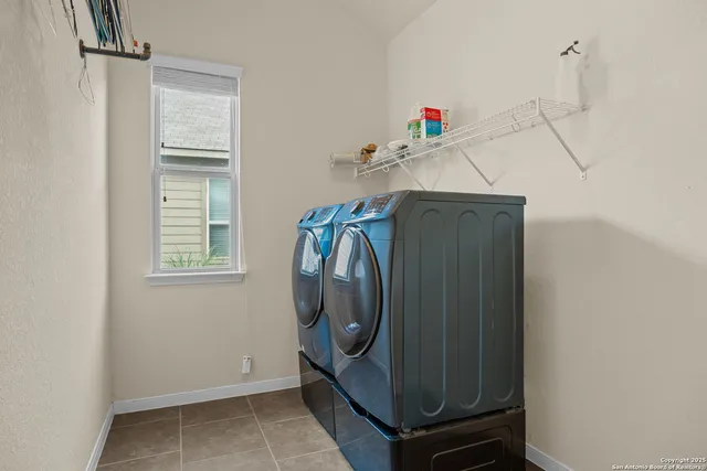 a utility room with dryer and washer