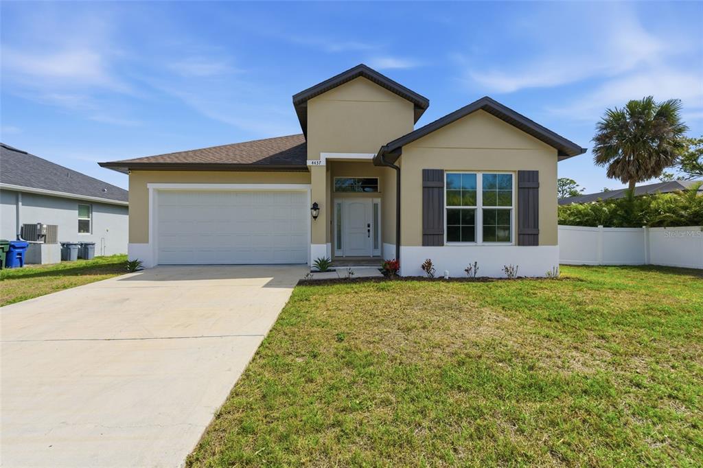4437 Meridian Road Venice, FL 34293 - Photo 2 of 37 front view of a house with a yard