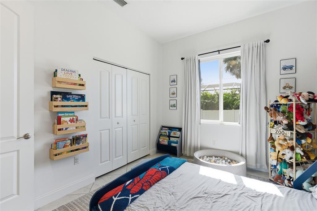 4437 Meridian Road Venice, FL 34293 - Photo 29 of 37 a bedroom with bed and a window