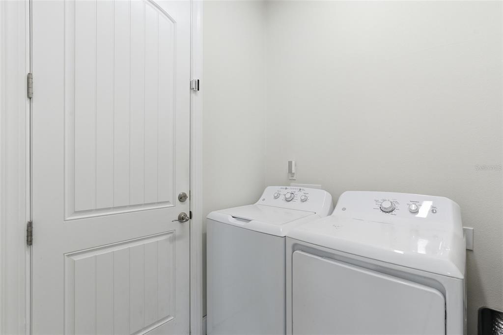 4437 Meridian Road Venice, FL 34293 - Photo 30 of 37 a utility room with dryer and washer