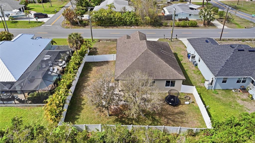 4437 Meridian Road Venice, FL 34293 - Photo 33 of 37 an aerial view of a house with a garden
