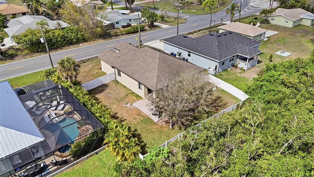4437 Meridian Road Venice, FL 34293 - Photo 34 of 37 an aerial view of a house with a yard