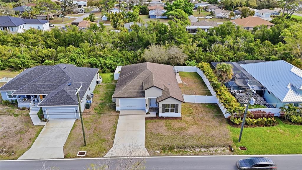 4437 Meridian Road Venice, FL 34293 - Photo 36 of 37 an aerial view of a house with yard swimming pool and outdoor seating