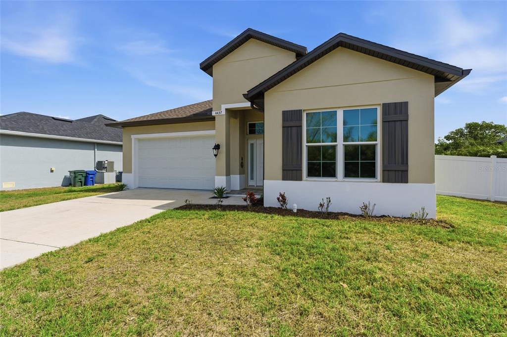 4437 Meridian Road Venice, FL 34293 - Photo 37 of 37 a front view of a house with a yard
