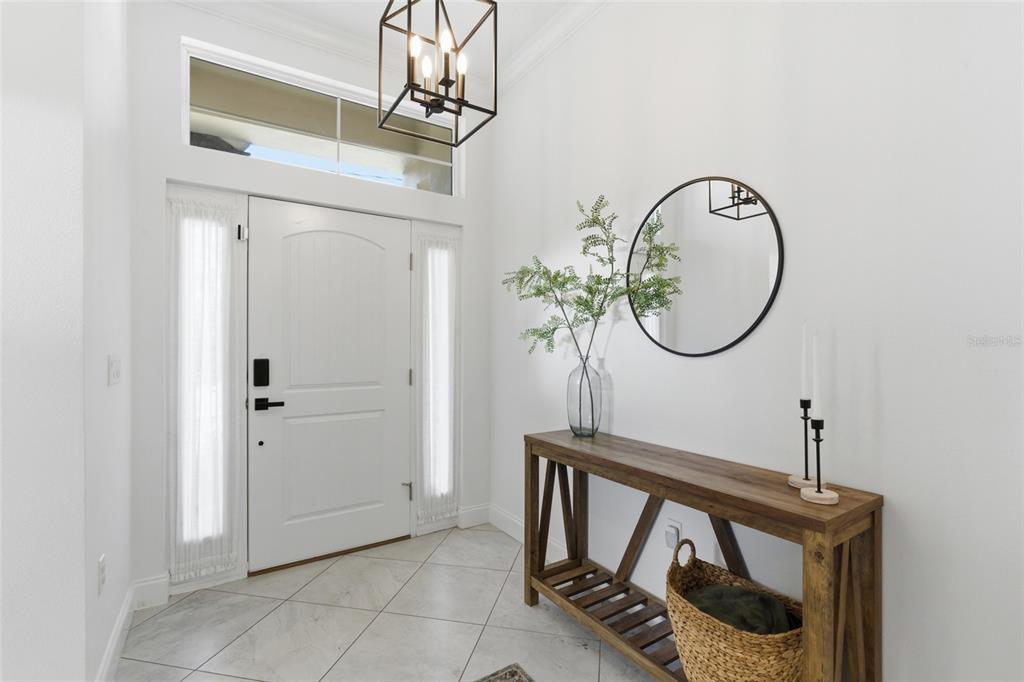 4437 Meridian Road Venice, FL 34293 - Photo 4 of 37 a front view of a house with entryway