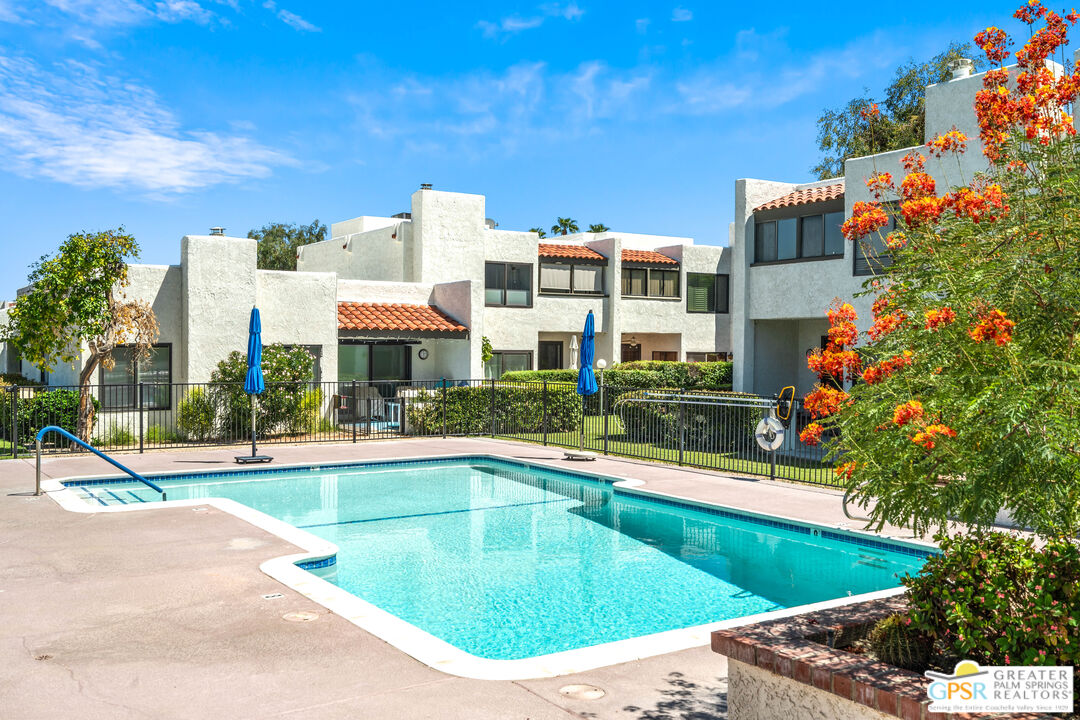 616 Violeta Drive Palm Springs, CA 92262 - Photo 1 of 30 a view of a swimming pool with a lounge chairs