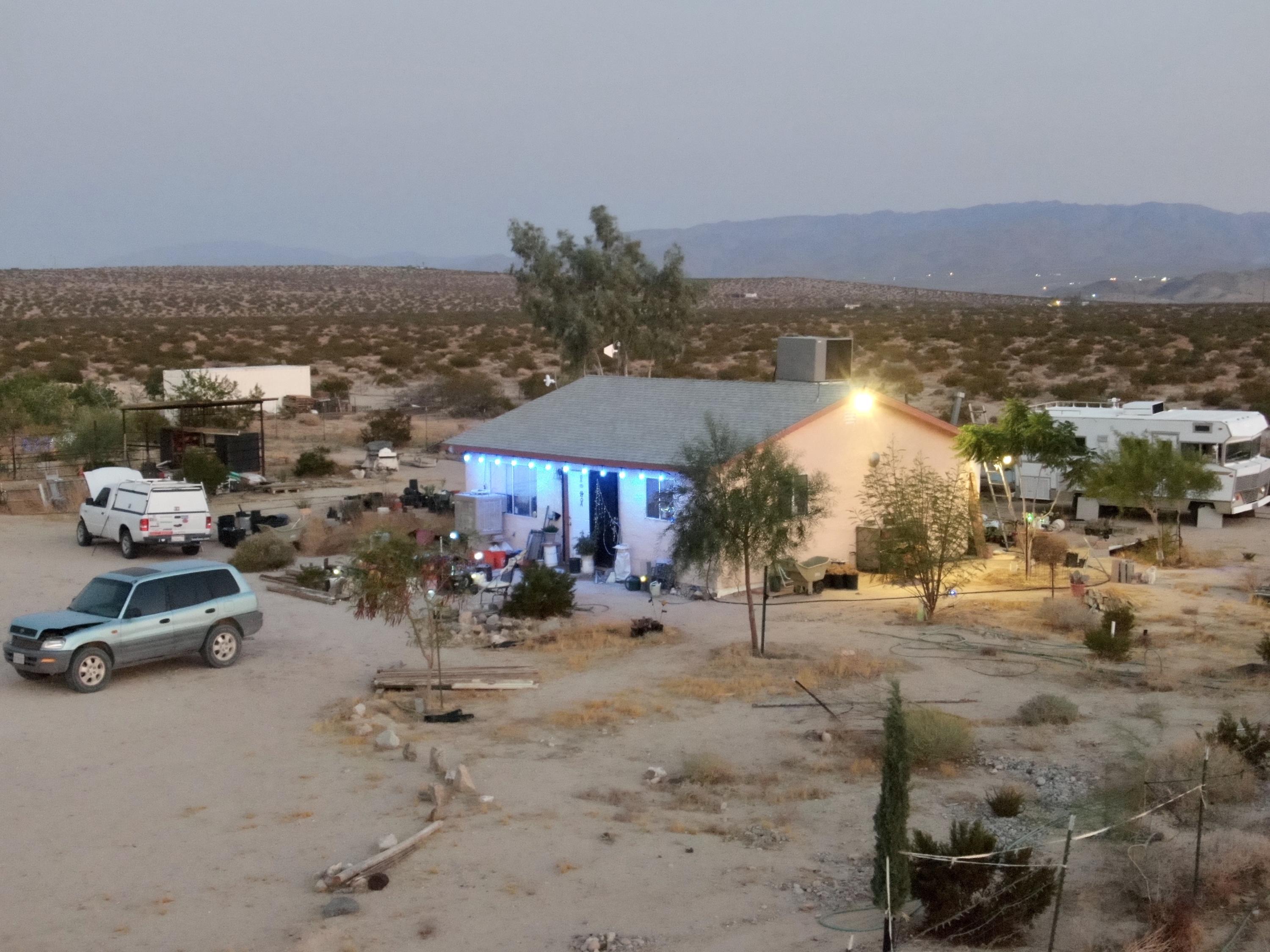 66855 Winters Road Joshua Tree, CA 92252 - Photo 2 of 19 a car parked on the side of the road