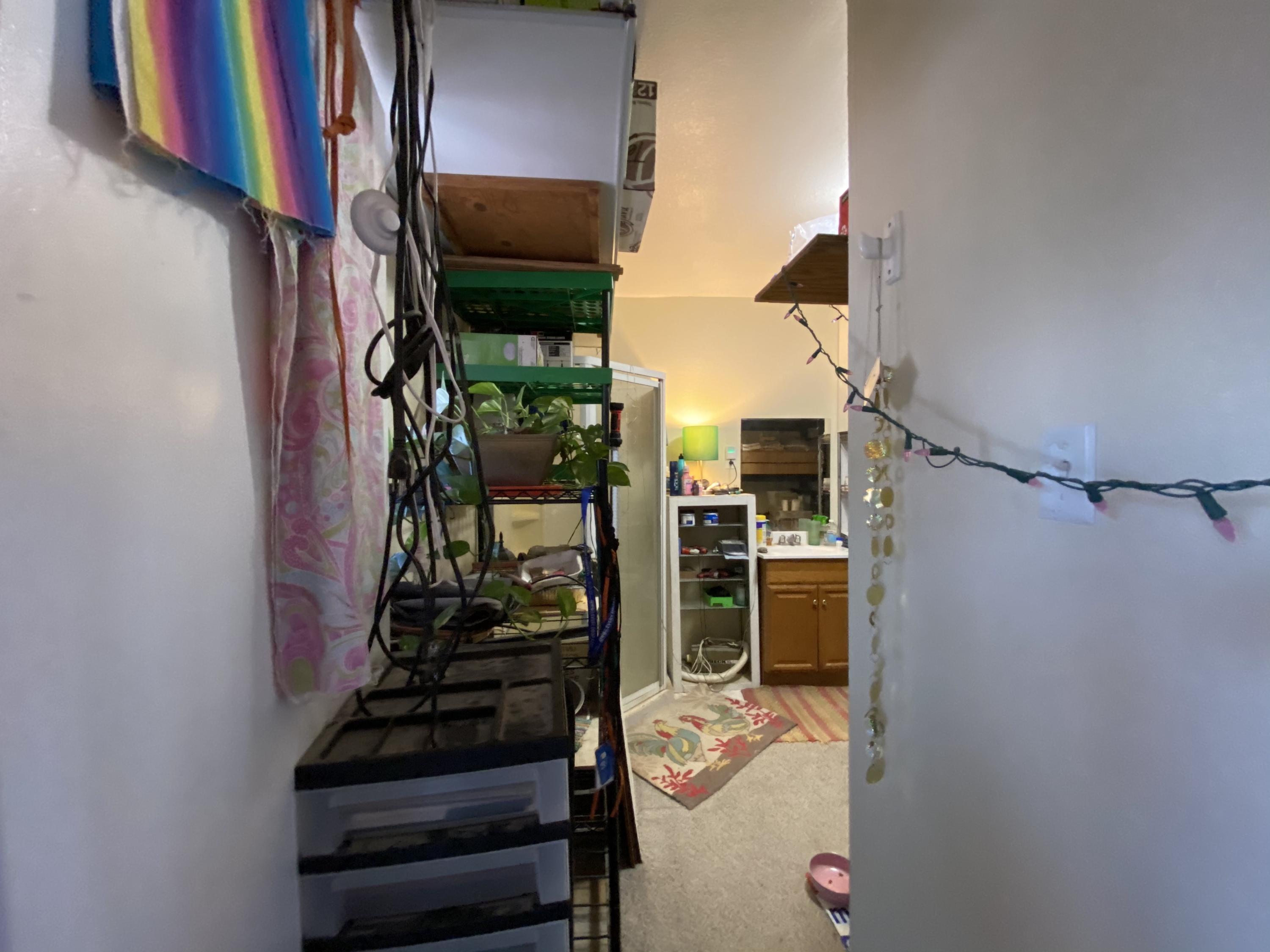 66855 Winters Road Joshua Tree, CA 92252 - Photo 8 of 19 a view of walk in closet with clothes and shoes