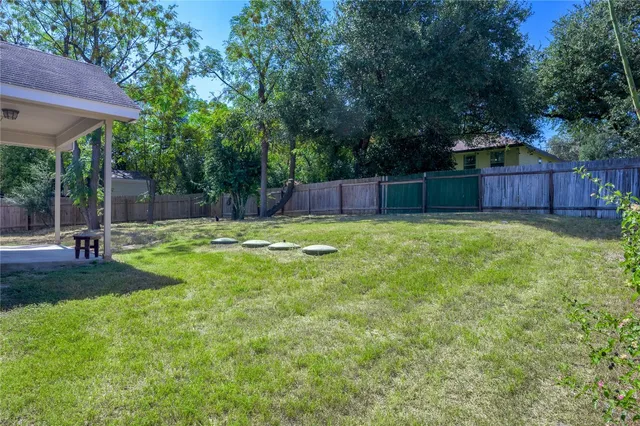 a view of a backyard with a small cabin