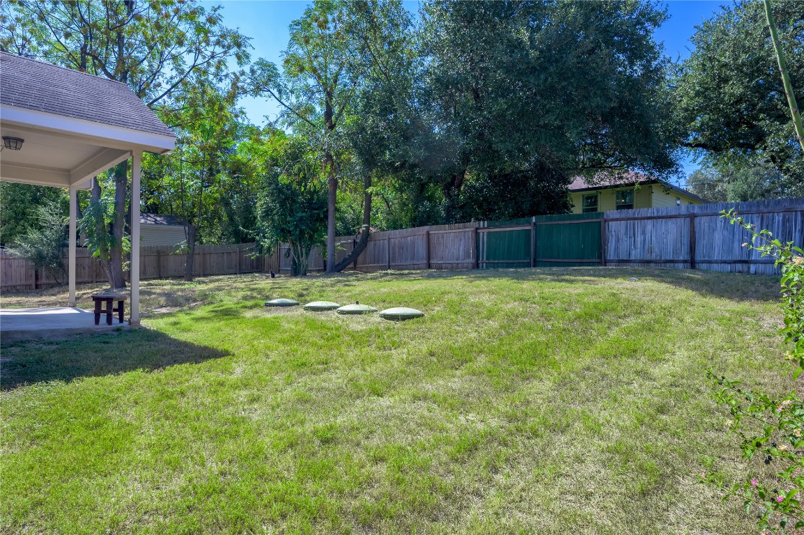 2016 Whitebead Trail Austin, TX 78734 - Photo 16 of 31 a view of a backyard with a small cabin