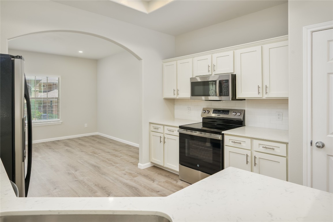 2016 Whitebead Trail Austin, TX 78734 - Photo 5 of 31 a kitchen with a stove top oven and sink