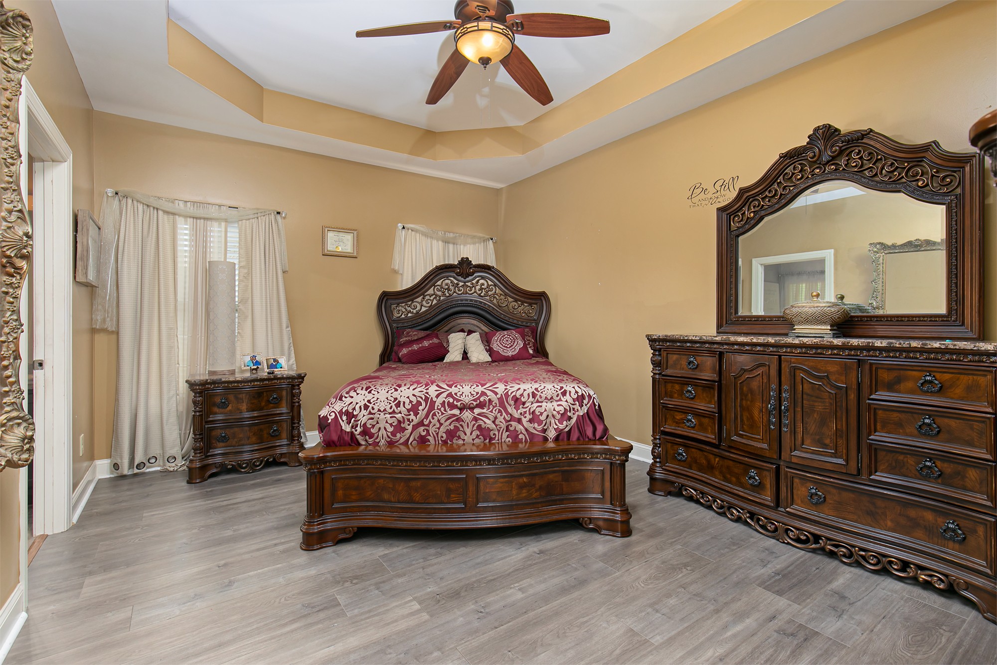 105 Larkin Springs Road Madison, TN 37115 - Photo 2 of 6 a bedroom with a bed and a dresser