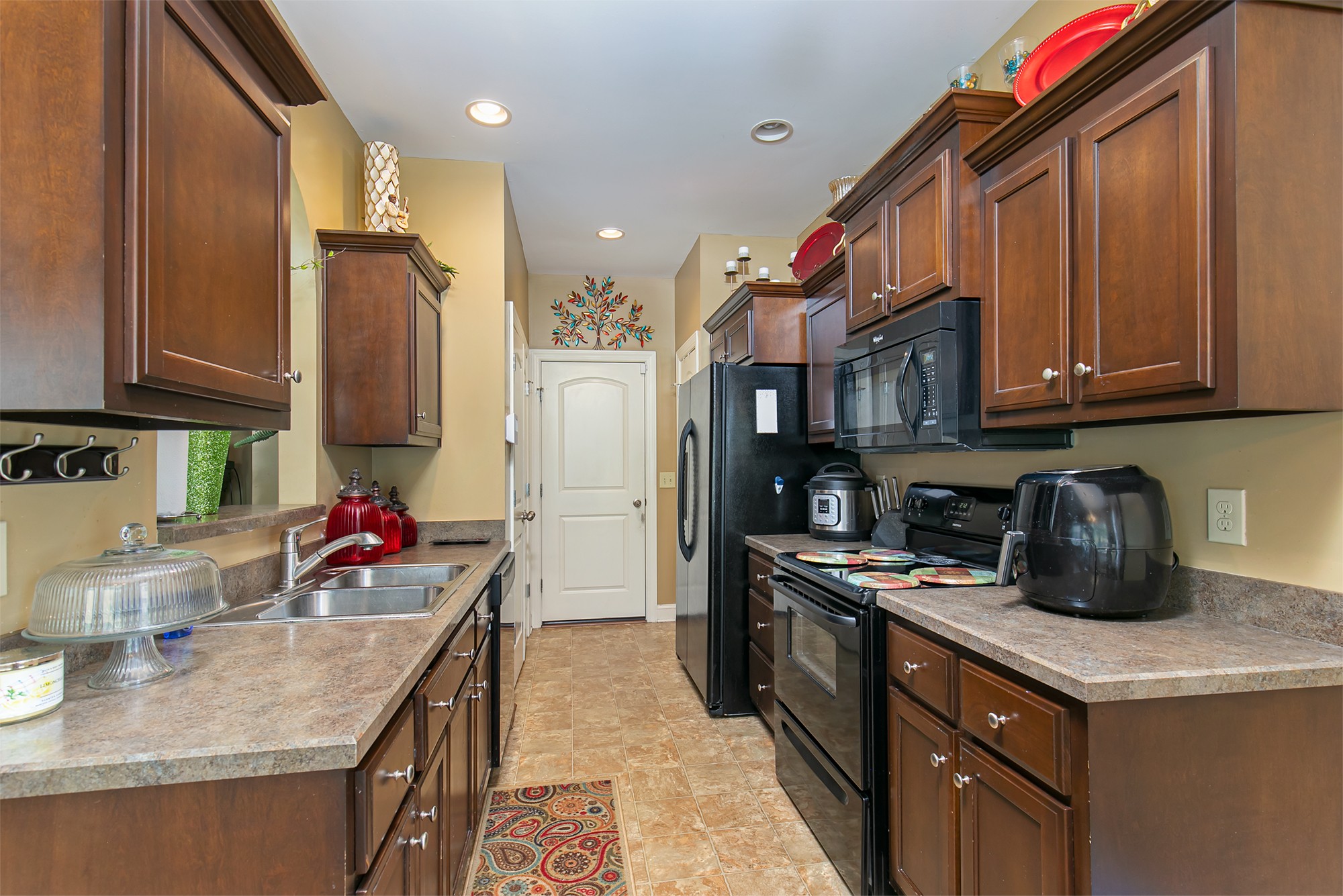 105 Larkin Springs Road Madison, TN 37115 - Photo 3 of 6 a kitchen with stainless steel appliances granite countertop a sink stove and refrigerator