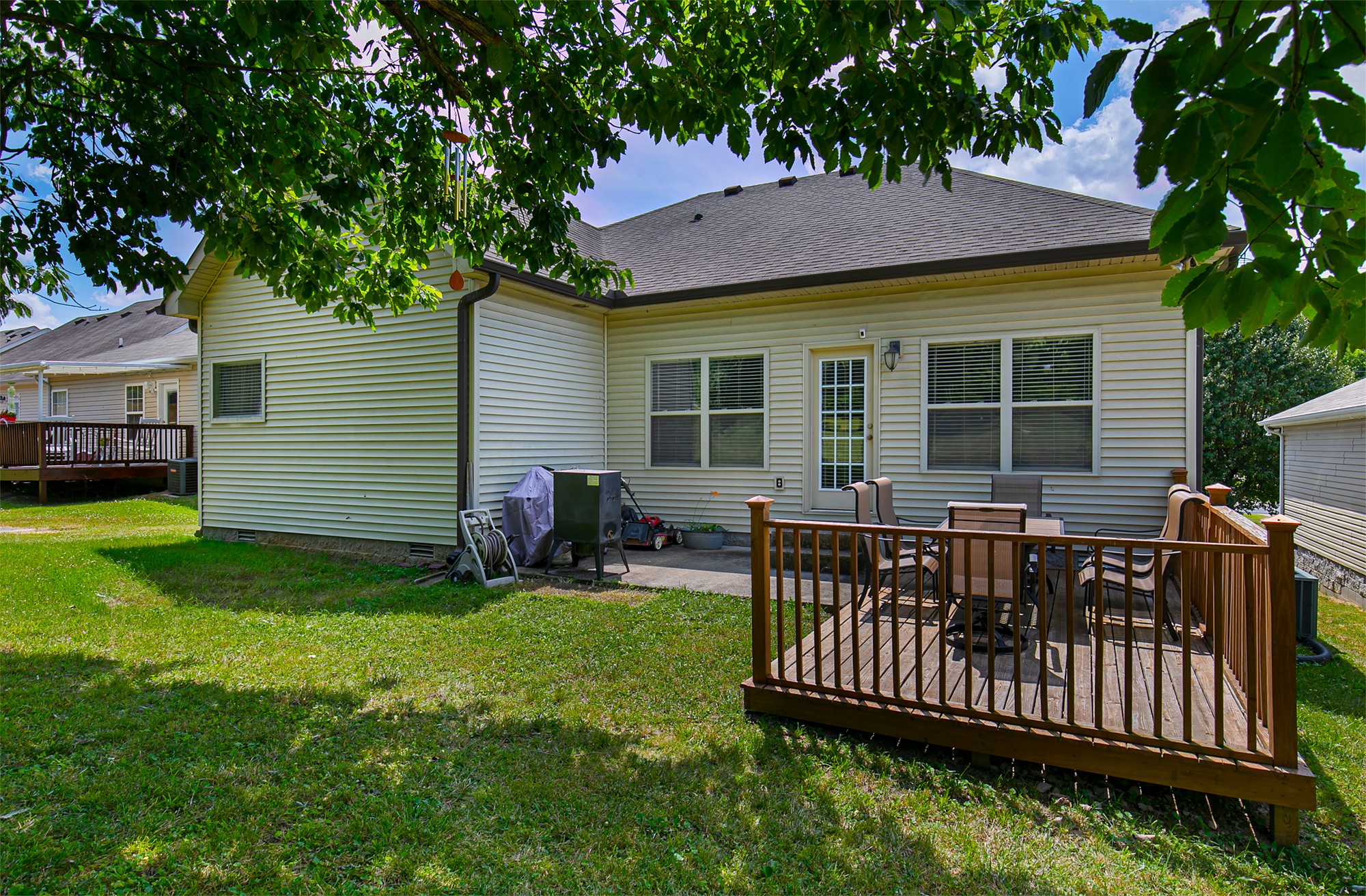 105 Larkin Springs Road Madison, TN 37115 - Photo 6 of 6 a view of a house with a backyard and a patio